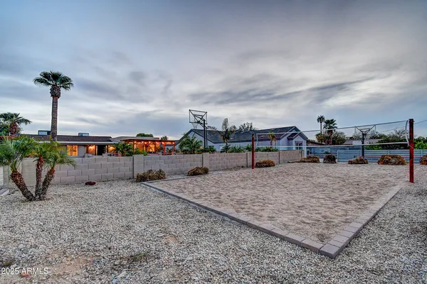 a view of a chairs and table in patio