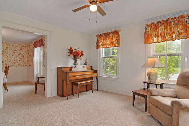 128 Howard Street Geneva, IL 60134 - Photo 11 of 29 a living room with furniture and a window