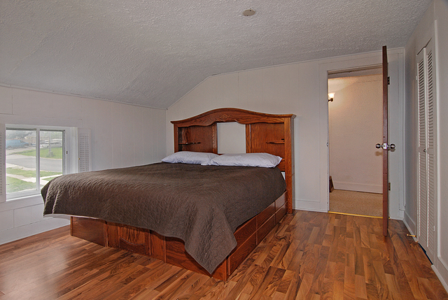 128 Howard Street Geneva, IL 60134 - Photo 13 of 29 a bedroom with a bed and a window