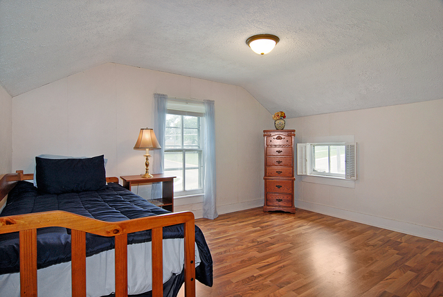 128 Howard Street Geneva, IL 60134 - Photo 16 of 29 a bedroom with furniture and wooden floor