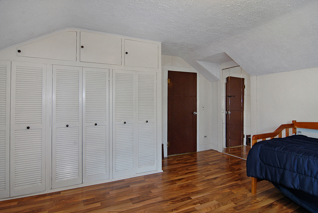 128 Howard Street Geneva, IL 60134 - Photo 17 of 29 a view of a bedroom with wooden floor