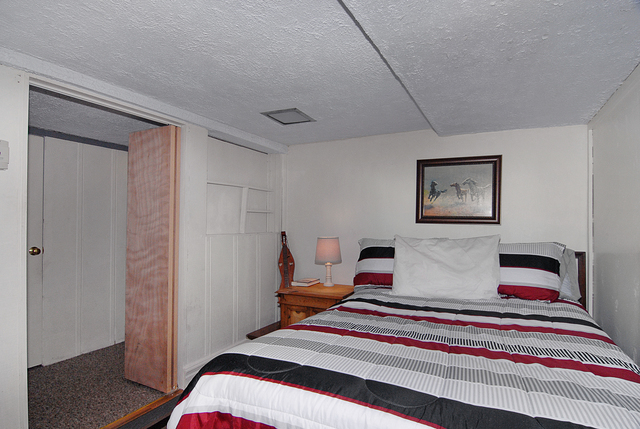 128 Howard Street Geneva, IL 60134 - Photo 18 of 29 a bedroom with bed and cupboard