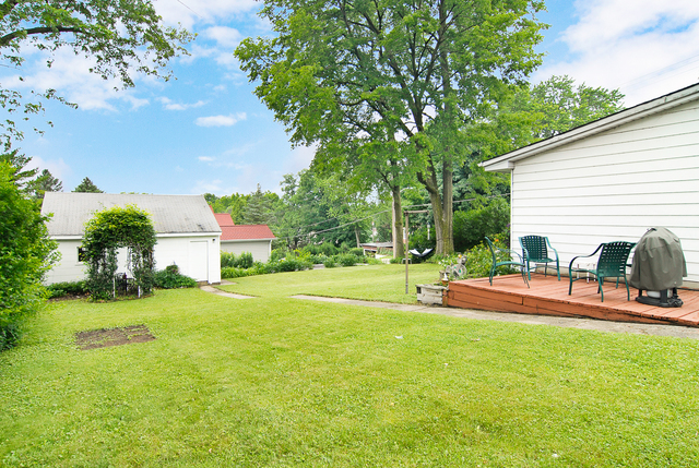 128 Howard Street Geneva, IL 60134 - Photo 19 of 29 a house view with a sitting space and garden