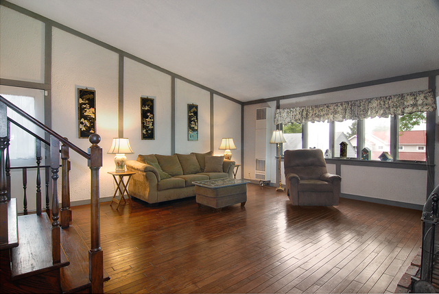 128 Howard Street Geneva, IL 60134 - Photo 3 of 29 a living room with furniture wooden floor and a large window