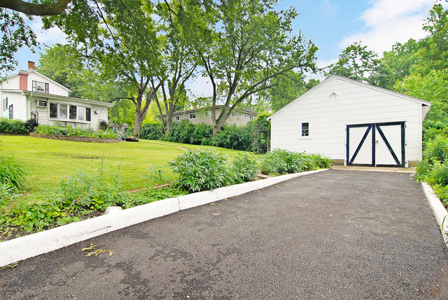 128 Howard Street Geneva, IL 60134 - Photo 21 of 29 a view of backyard of house and green space