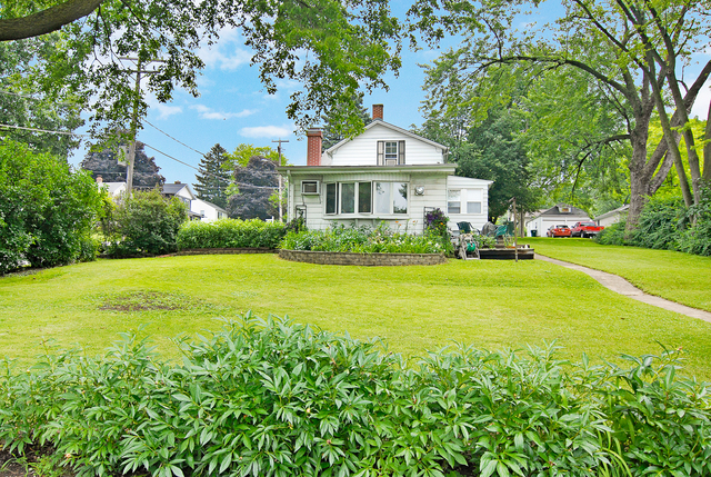 128 Howard Street Geneva, IL 60134 - Photo 22 of 29 a view of house with garden space and trees
