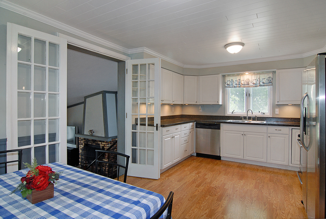 128 Howard Street Geneva, IL 60134 - Photo 5 of 29 a kitchen with granite countertop a sink cabinets and appliances