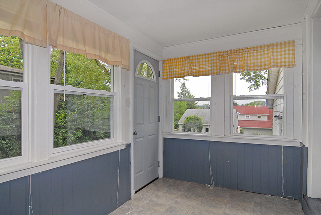 128 Howard Street Geneva, IL 60134 - Photo 7 of 29 a view of an empty room with a window