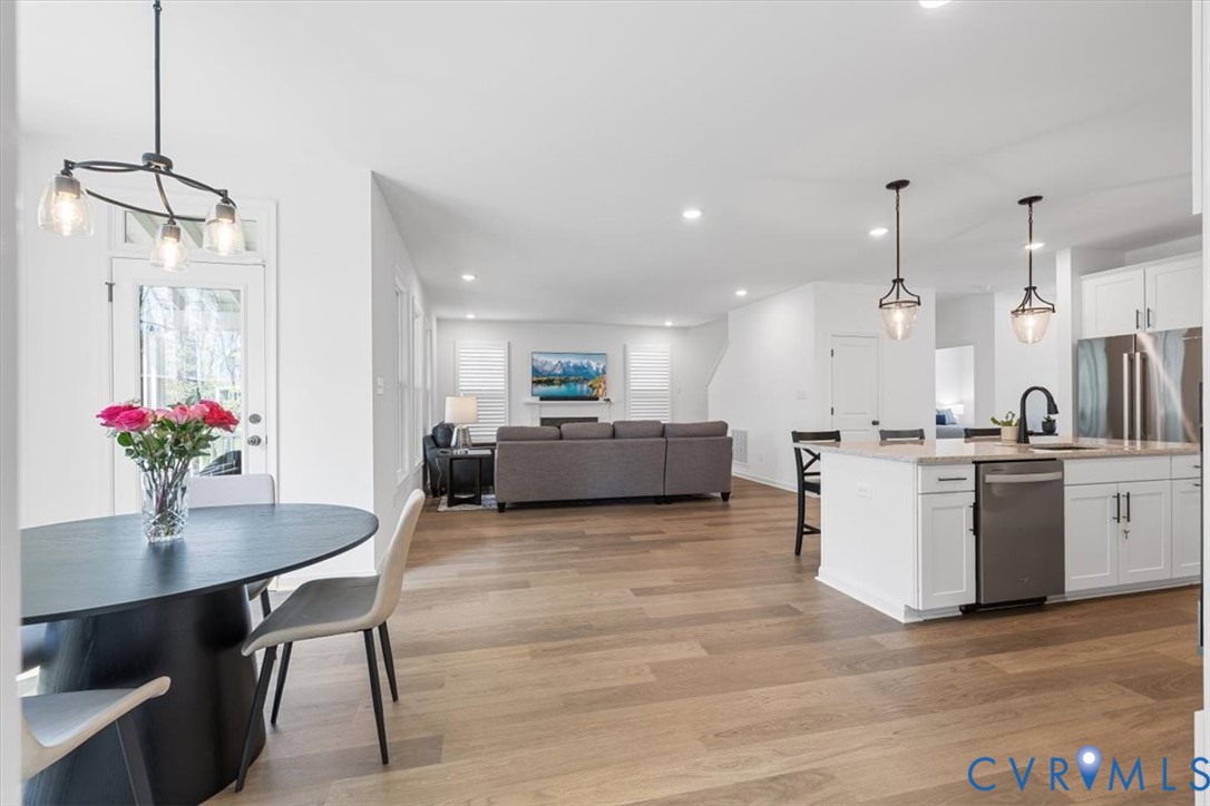17131 Westington Road Moseley, VA 23120 - Photo 15 of 34 a living room with kitchen island furniture and a kitchen view