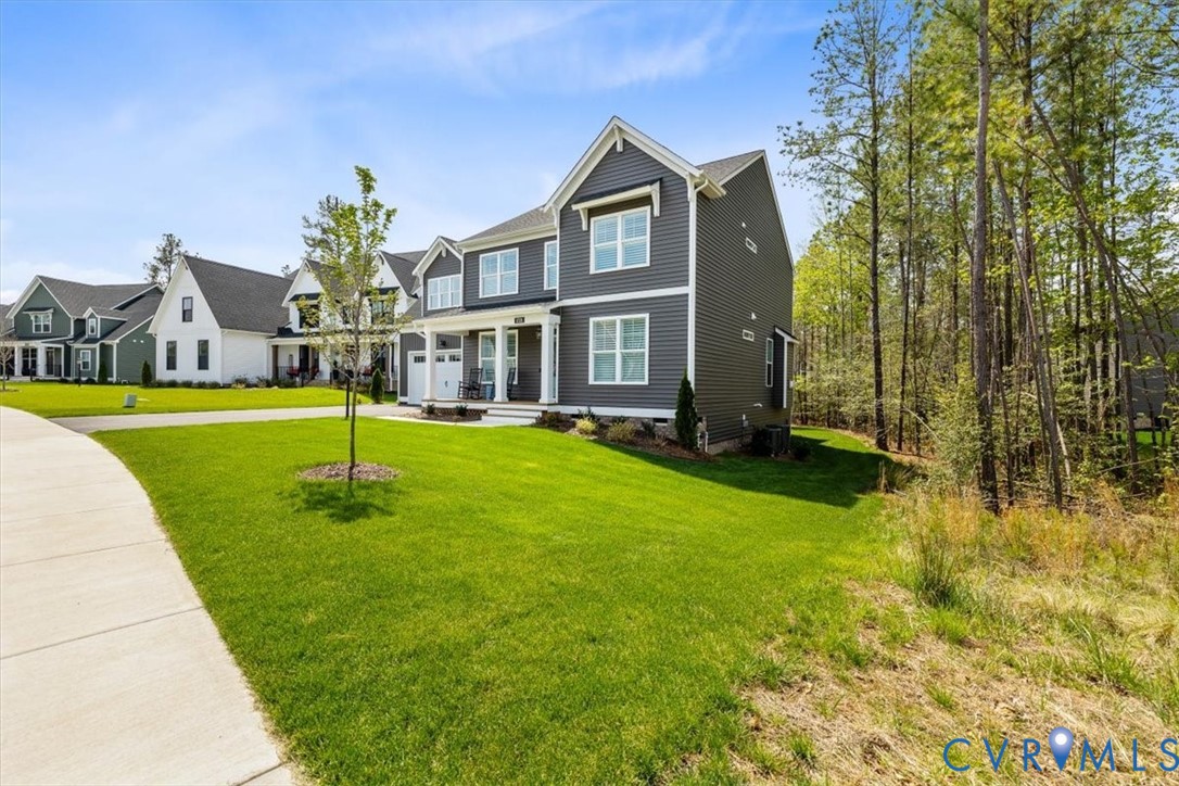 17131 Westington Road Moseley, VA 23120 - Photo 2 of 34 a front view of a house with a yard