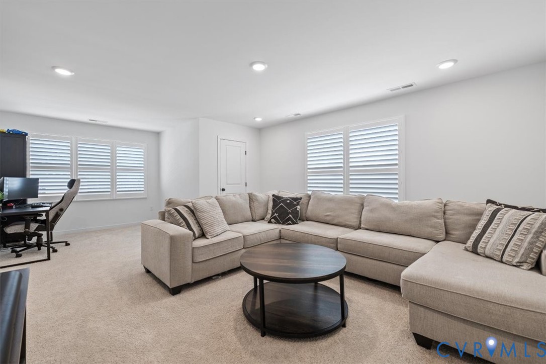 17131 Westington Road Moseley, VA 23120 - Photo 27 of 34 a living room with furniture and a large window