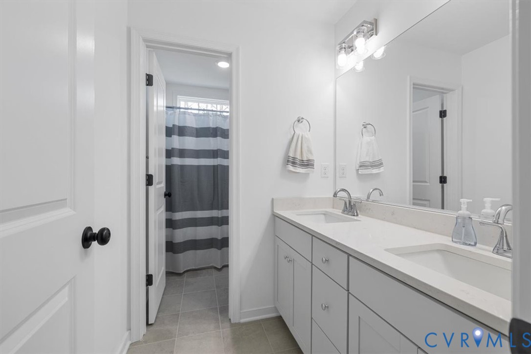 17131 Westington Road Moseley, VA 23120 - Photo 29 of 34 a bathroom with a sink vanity and mirror