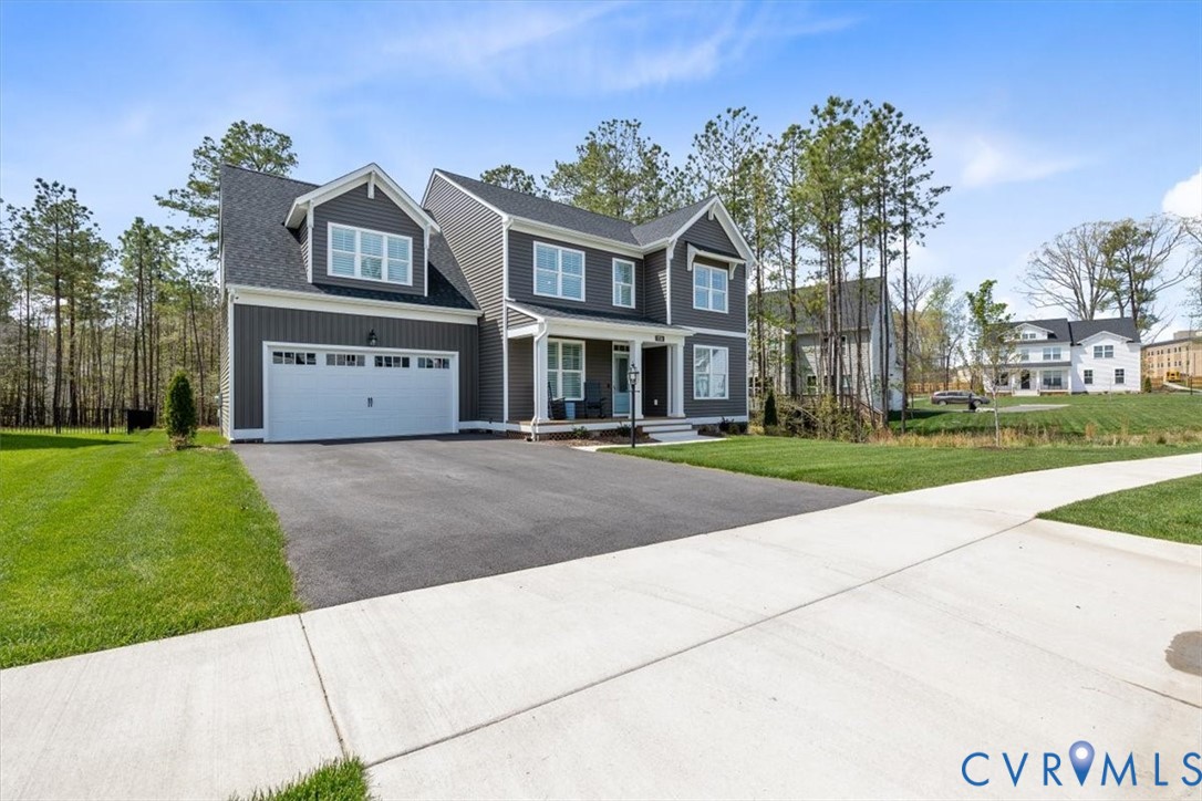 17131 Westington Road Moseley, VA 23120 - Photo 3 of 34 a front view of a residential apartment building with a yard