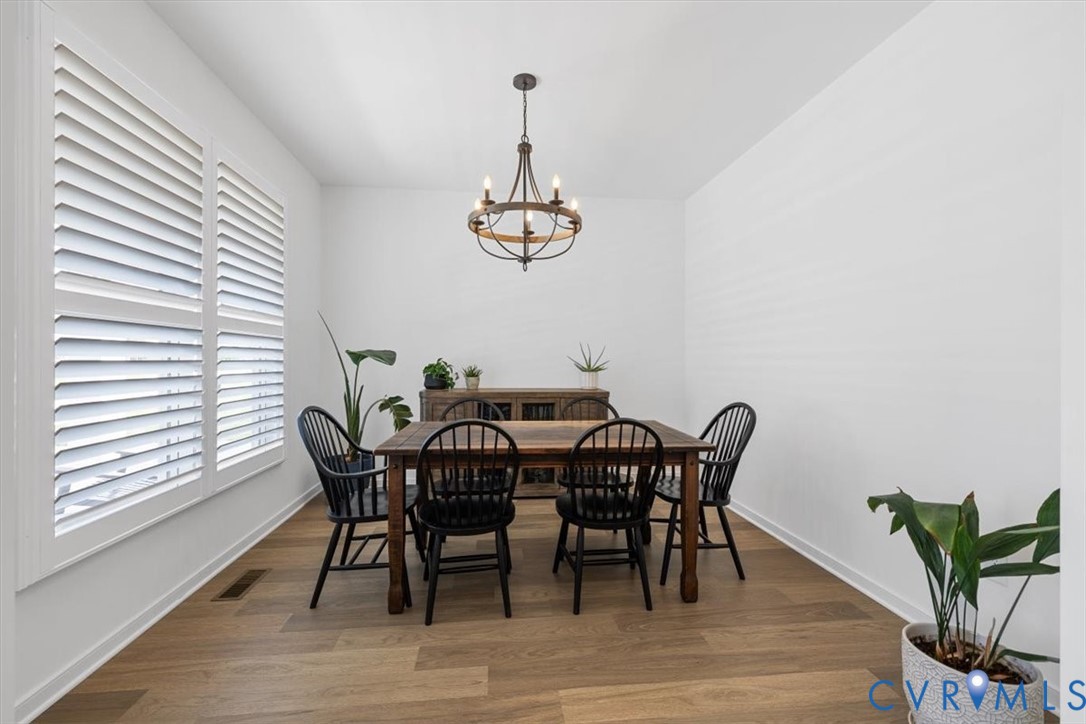 17131 Westington Road Moseley, VA 23120 - Photo 10 of 34 a view of a dining room with furniture window and wooden floor