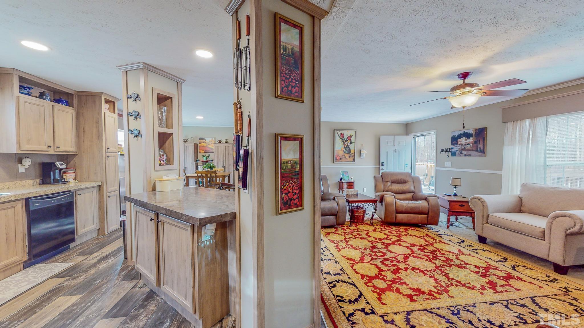 100 Marco Road Roxboro, NC 27574 - Photo 12 of 47 a living room with furniture and a kitchen