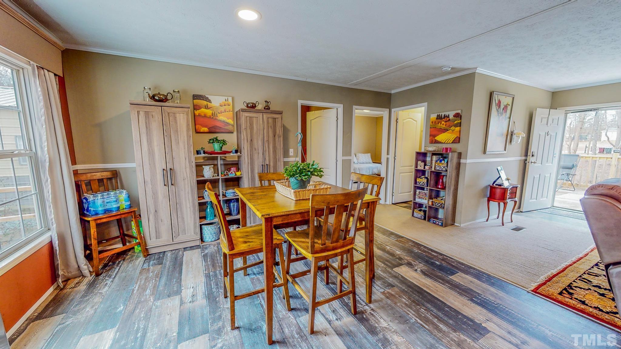 100 Marco Road Roxboro, NC 27574 - Photo 24 of 47 a view of a dining room with furniture and a window
