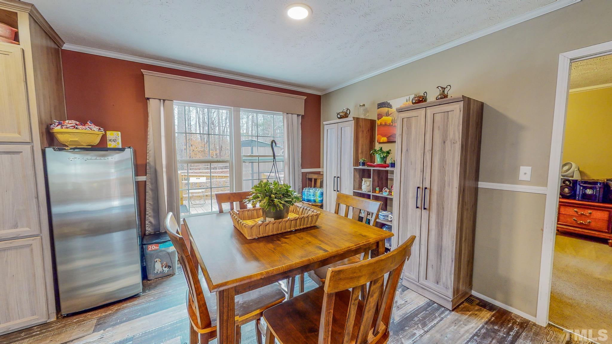 100 Marco Road Roxboro, NC 27574 - Photo 31 of 47 a dining room with furniture and a window