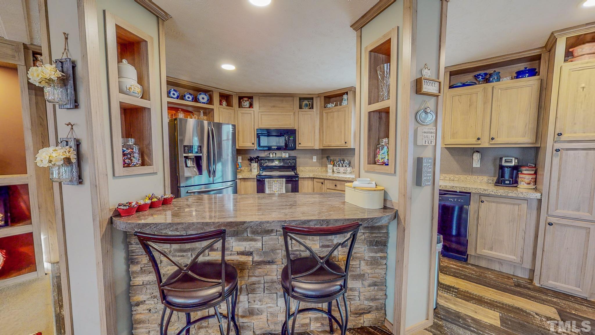 100 Marco Road Roxboro, NC 27574 - Photo 4 of 47 a kitchen with stainless steel appliances granite countertop a refrigerator and microwave