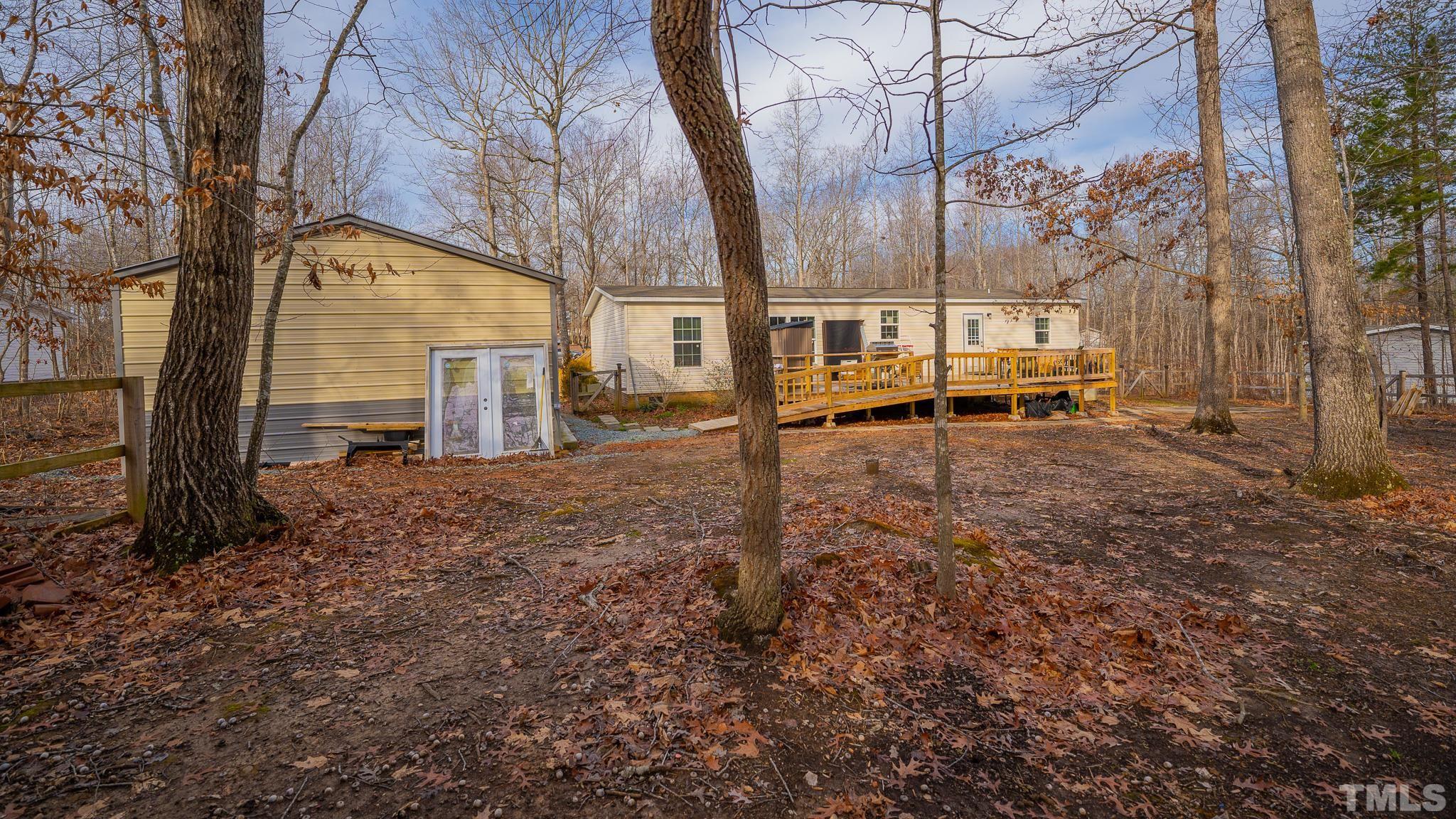 100 Marco Road Roxboro, NC 27574 - Photo 43 of 47 a backyard of a house with table and chairs