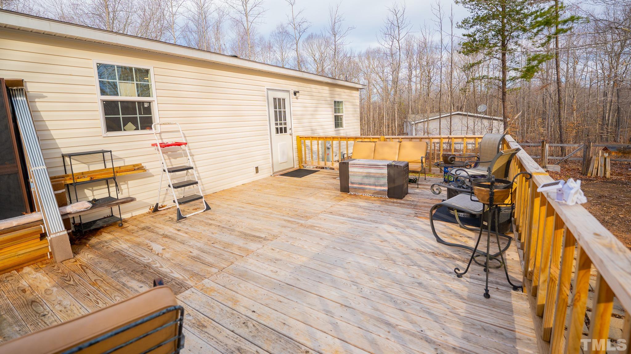 100 Marco Road Roxboro, NC 27574 - Photo 46 of 47 a backyard of a house with table and chairs