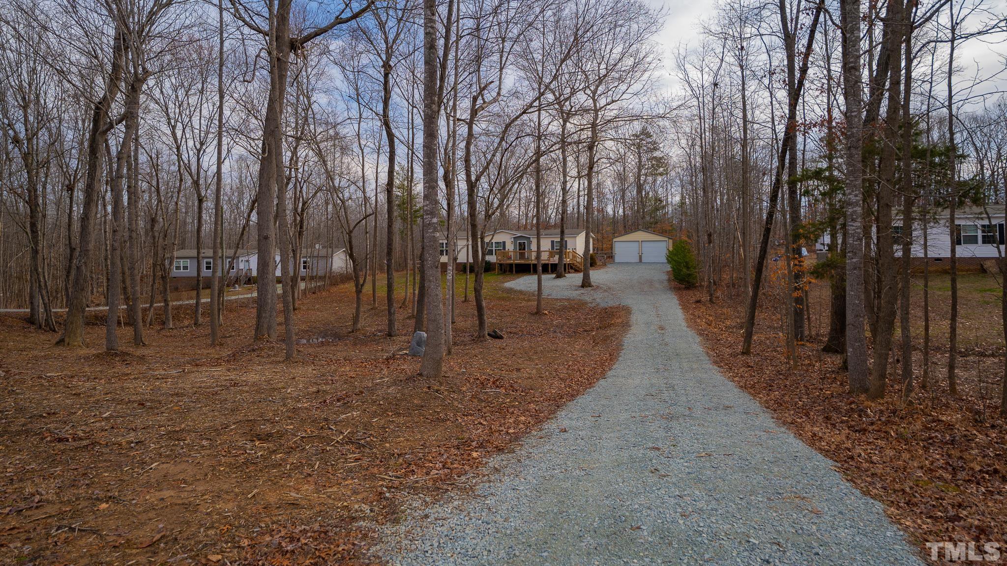 100 Marco Road Roxboro, NC 27574 - Photo 47 of 47 a view of outdoor space with lots of trees