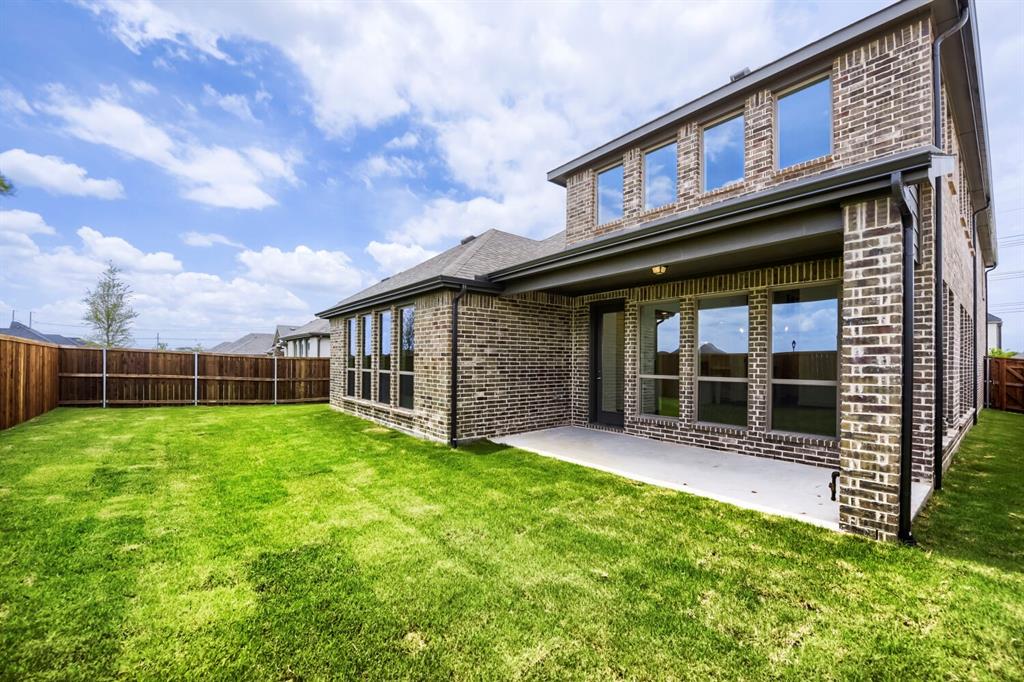 11548 Wulstone Road Haslet, TX 76052 - Photo 26 of 26 Expansive green lawn with a privacy fence
