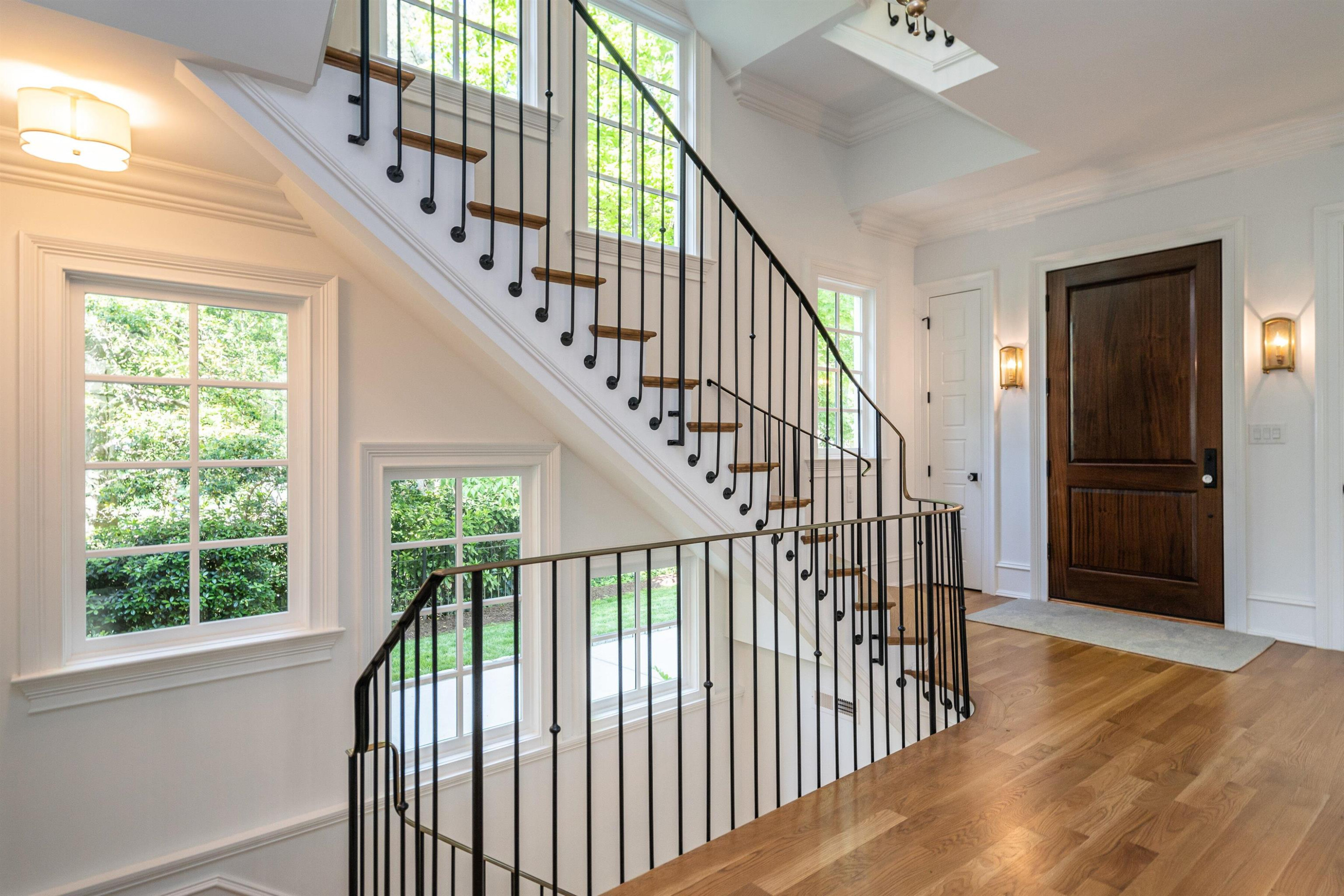 1602 Jarvis Street Raleigh, NC 27608 - Photo 4 of 49 Refined yet sturdy, custom iron railing embellishes a graceful staircase. Foyer