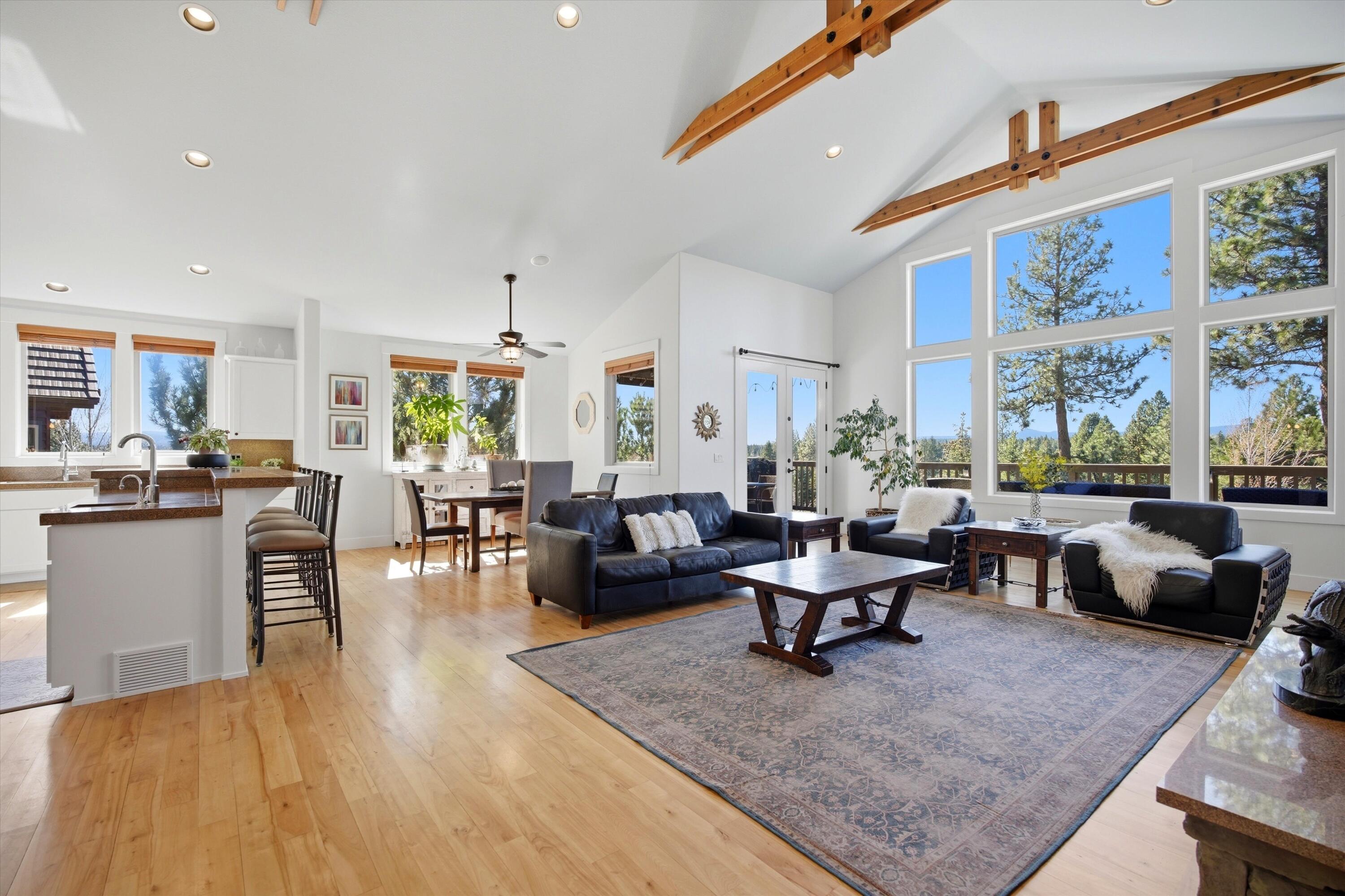 15 Southwest Quail Butte Place Bend, OR 97703 - Photo 15 of 55 a living room with furniture and a large window