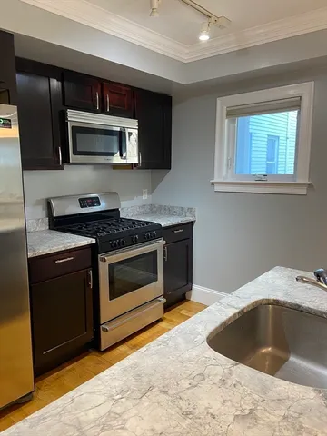 a kitchen with a stove and a microwave