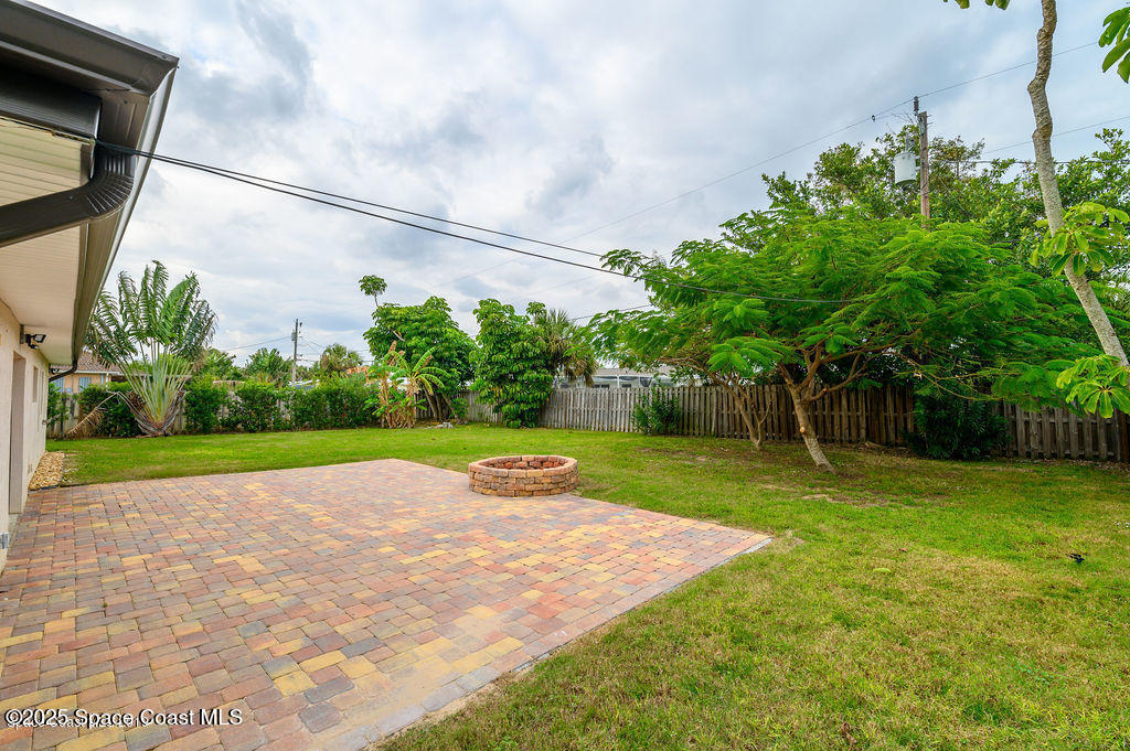 320 Pine Tree Drive Indialantic, FL 32903 - Photo 11 of 13 a view of yard with swimming pool