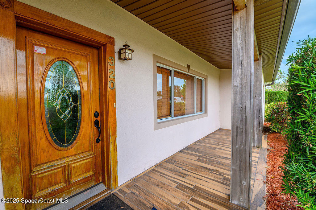320 Pine Tree Drive Indialantic, FL 32903 - Photo 2 of 13 a view of a house with a entryway