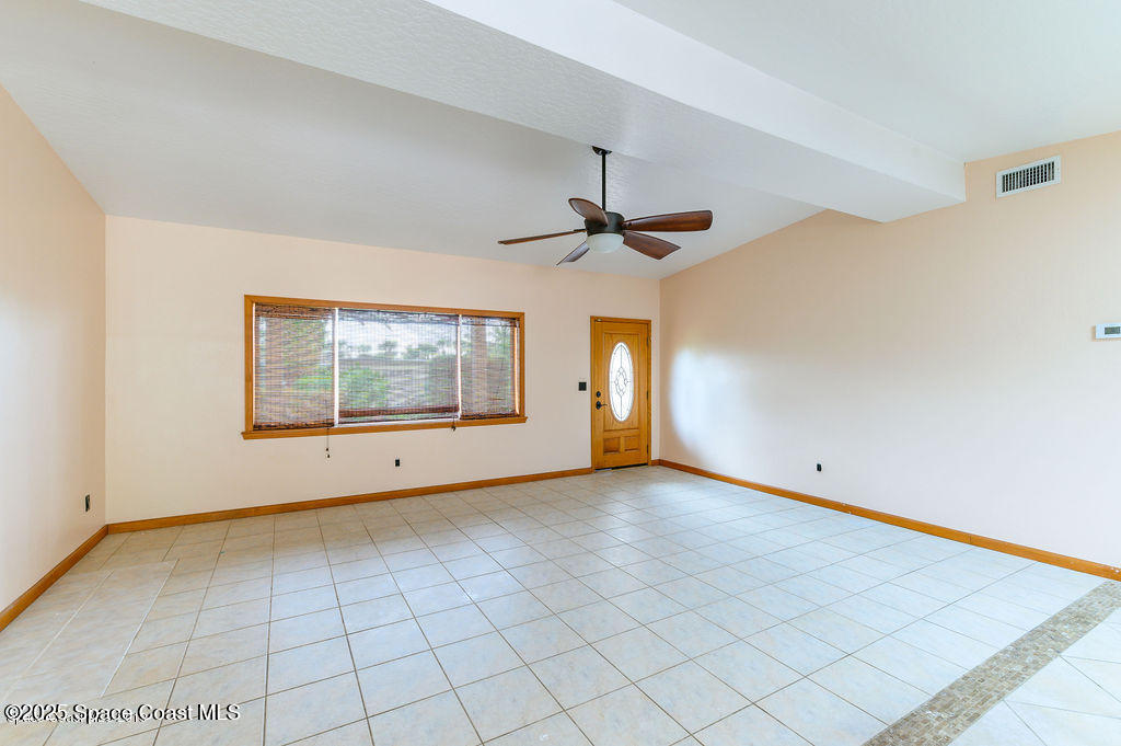 320 Pine Tree Drive Indialantic, FL 32903 - Photo 6 of 13 a view of an empty room with a window