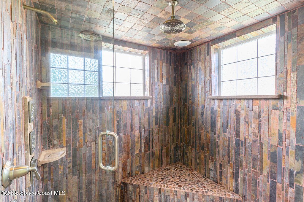 320 Pine Tree Drive Indialantic, FL 32903 - Photo 9 of 13 a bathroom with a shower