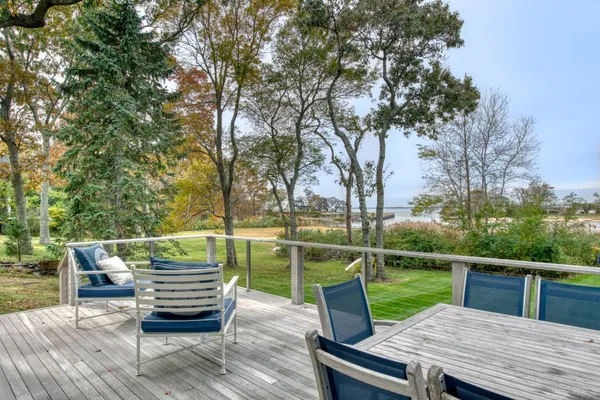 a view of house with patio and ocean view