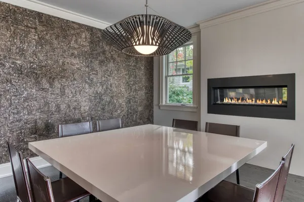 a view of a dining room with furniture and window