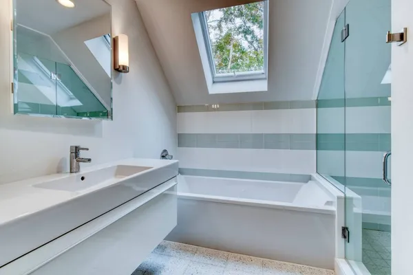 a bathroom with a bathtub and a sink