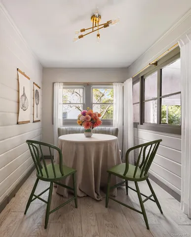 a view of a dining room with furniture window and outside view