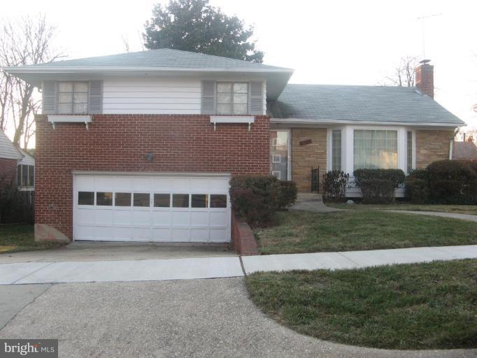 2007 Cascade Road Silver Spring, MD 20902 - Photo 2 of 12 a front view of a house with a garden