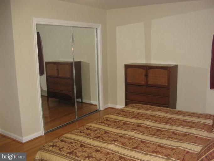 2007 Cascade Road Silver Spring, MD 20902 - Photo 12 of 12 a bedroom with a bed and a dresser