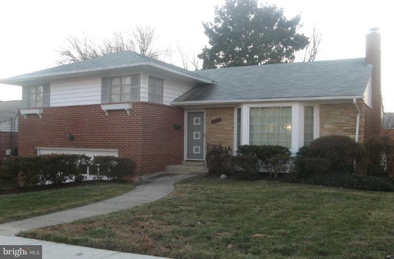2007 Cascade Road Silver Spring, MD 20902 - Photo 3 of 12 a front view of a house with garden