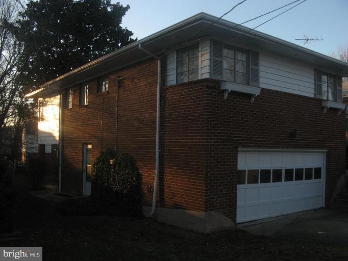 2007 Cascade Road Silver Spring, MD 20902 - Photo 4 of 12 a front view of a house with a yard