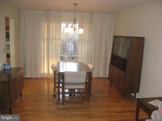 2007 Cascade Road Silver Spring, MD 20902 - Photo 5 of 12 a view of a dining room with furniture window and wooden floor