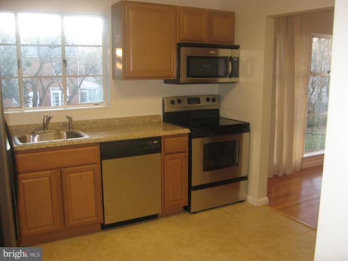 2007 Cascade Road Silver Spring, MD 20902 - Photo 7 of 12 a kitchen with a stove and a microwave