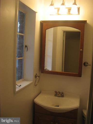 2007 Cascade Road Silver Spring, MD 20902 - Photo 10 of 12 a bathroom with a sink and a mirror