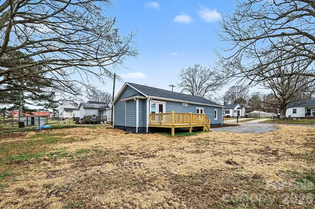 a house that has a tree in front of it
