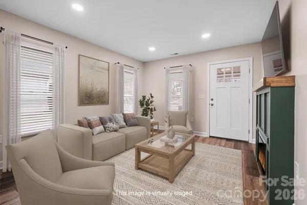 a living room with furniture and a window