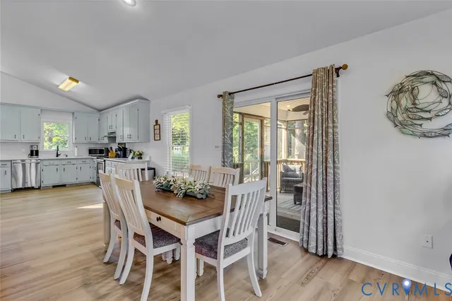 a dining room with furniture and window