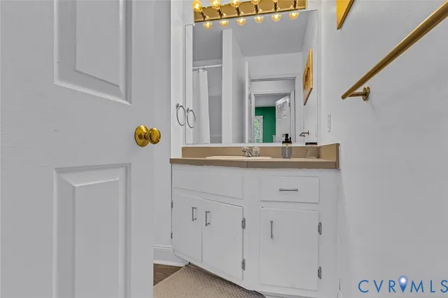 a white toilet sitting next to a shower curtain