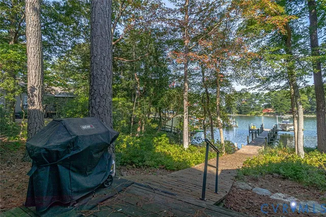 a view of a lake with chairs