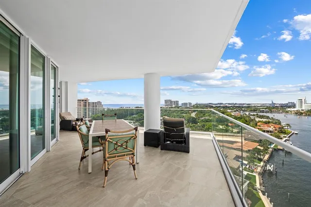 a terrace with outdoor seating and city view